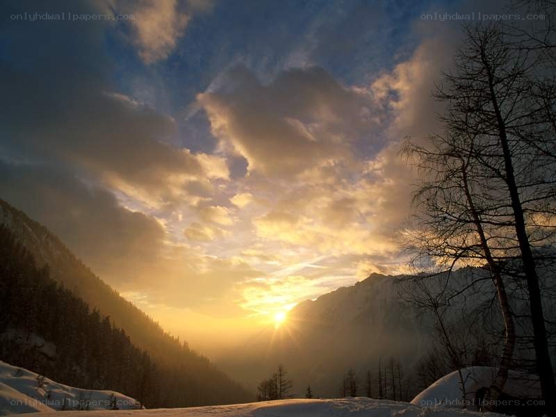 Sunset over snowy mountains