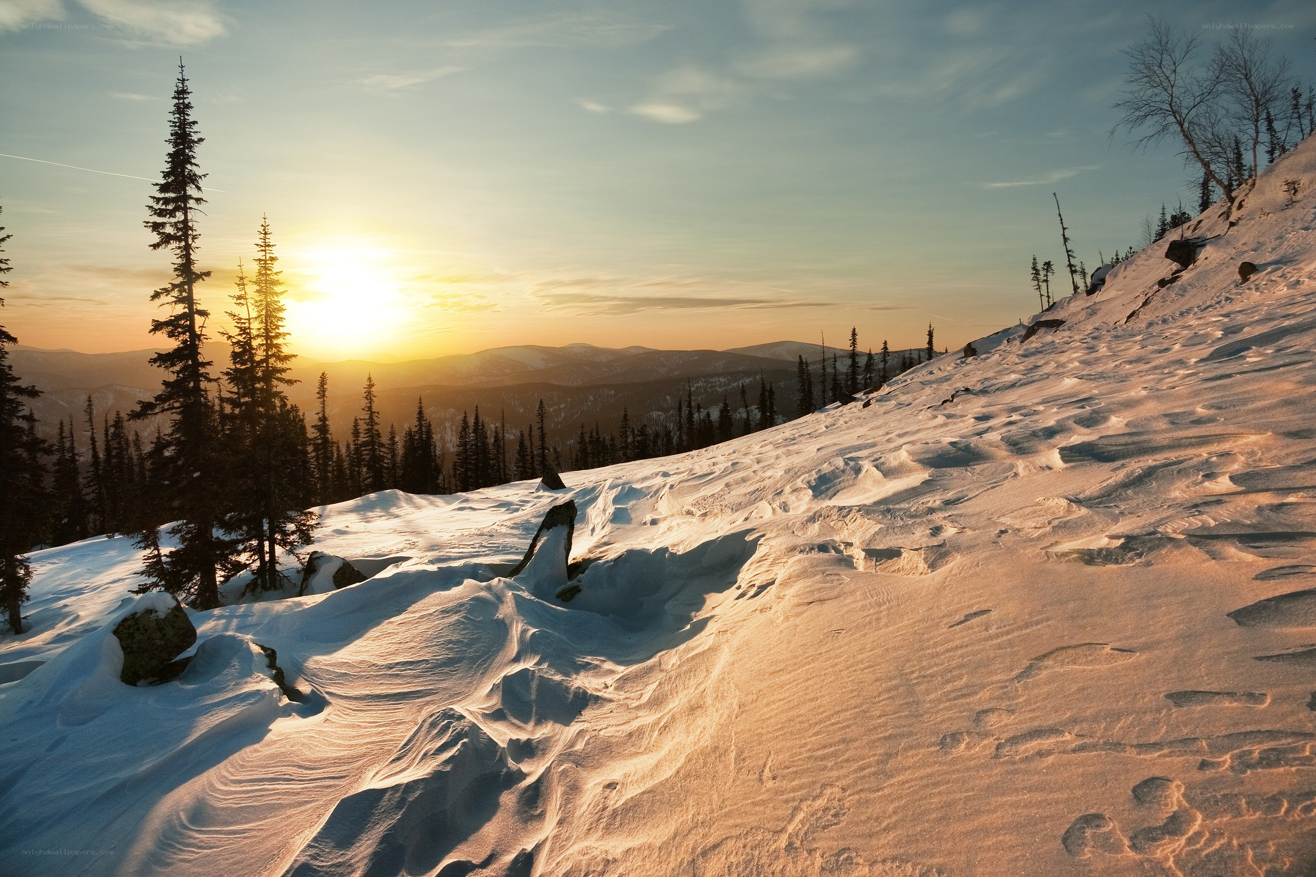 Sunset over snowy mountains
