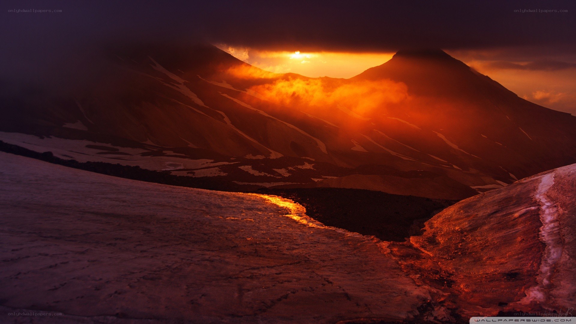 Sunset over snowy mountains