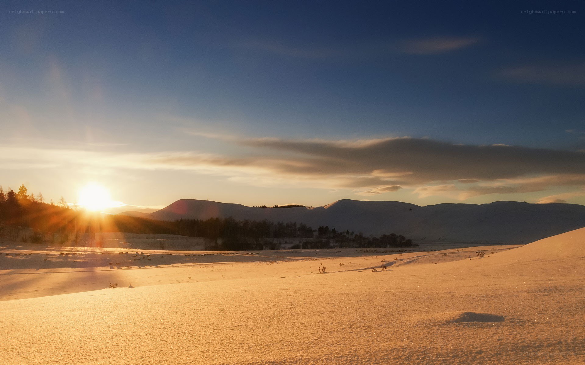 Sunset over snowy mountains