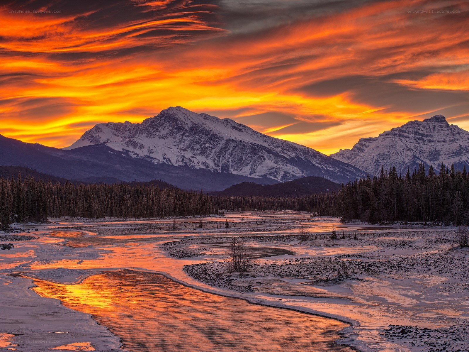Sunset over snowy mountains