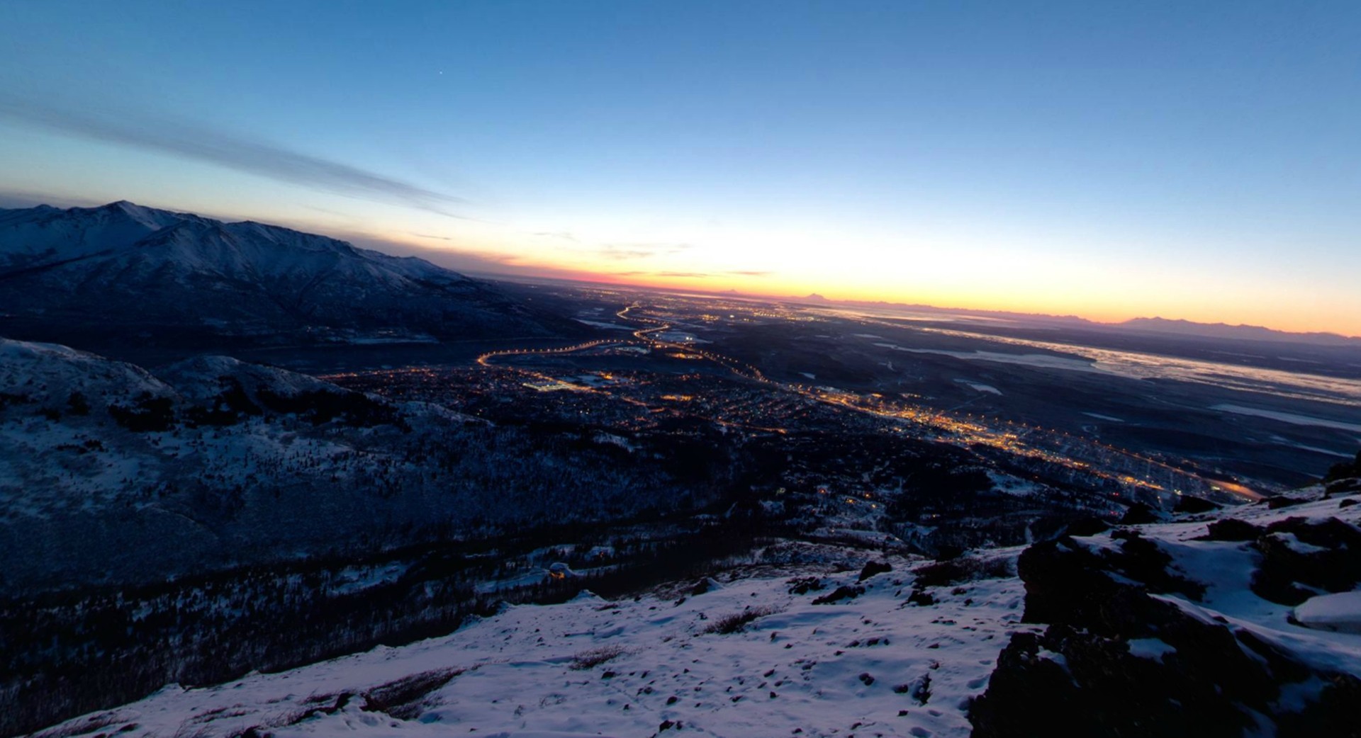 sunset over snowy mountains