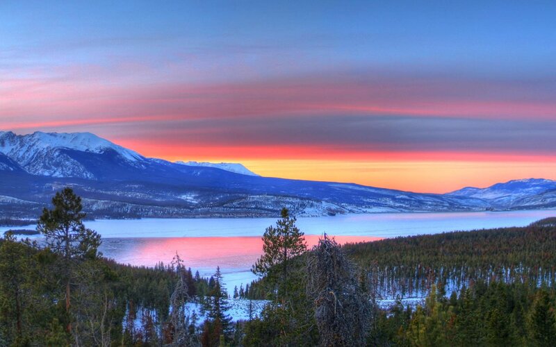 sunset over snowy mountains