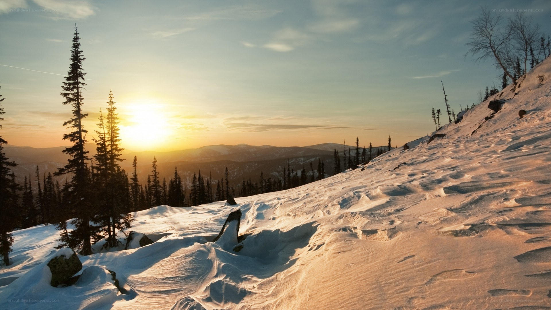 Sunset over snowy mountains