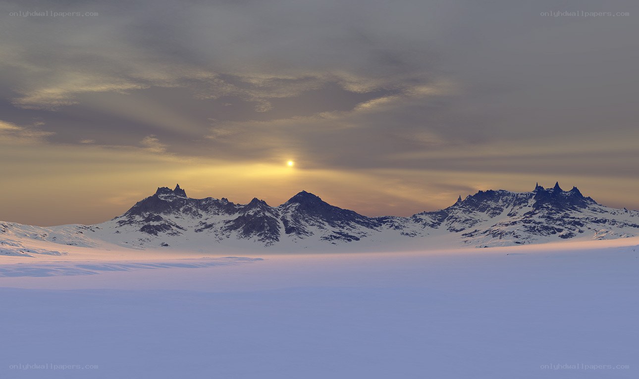 Sunset over snowy mountains