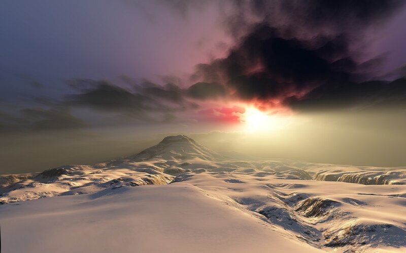 sunset over snowy mountains