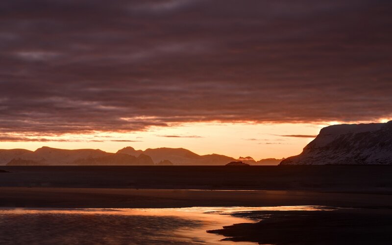 Sunset over snowy mountains