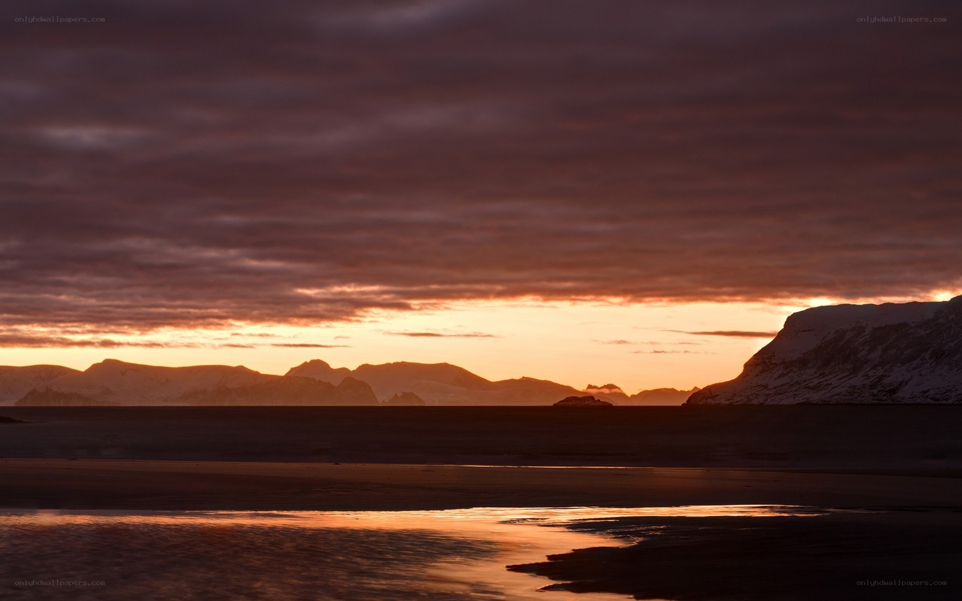Sunset over snowy mountains