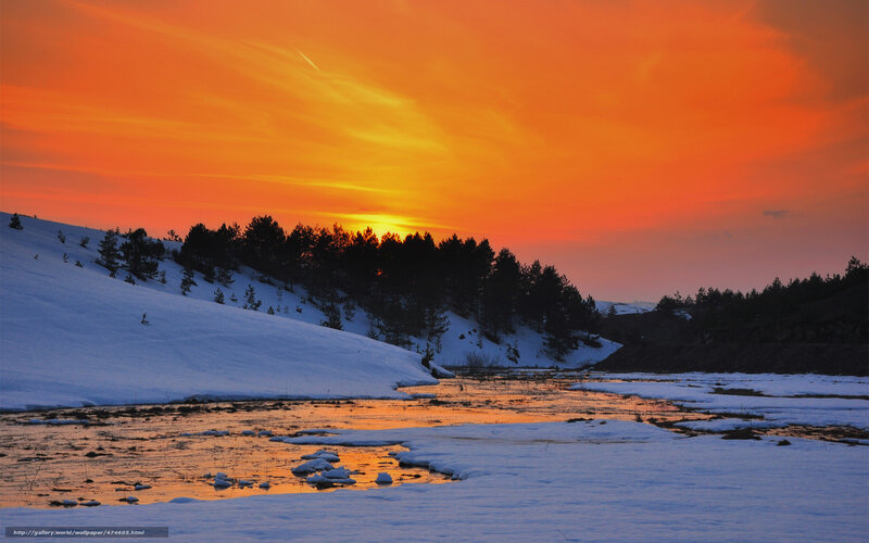 Sunset over snowy river