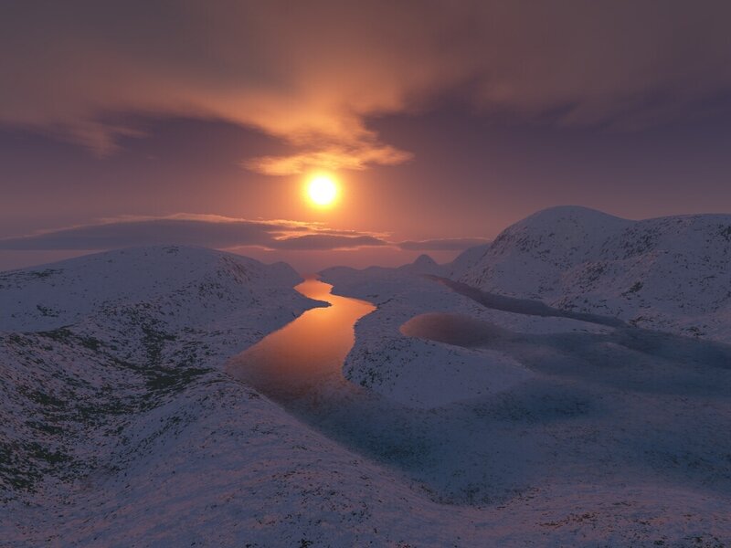 Sunset over snowy river valley