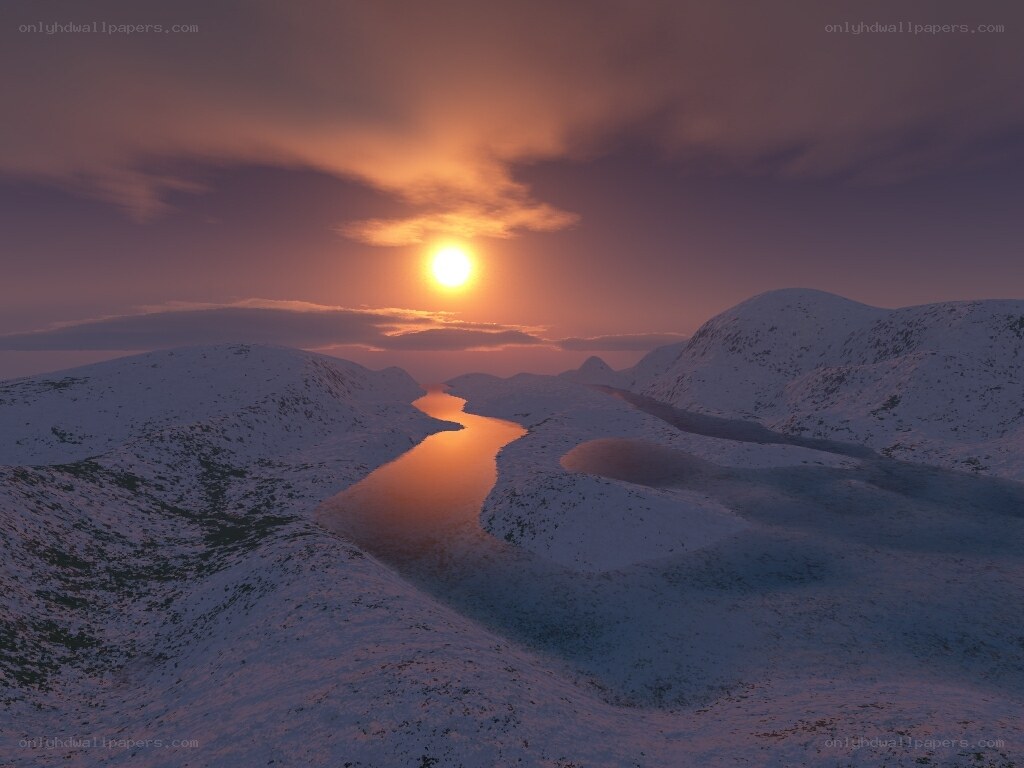 Sunset over snowy river valley