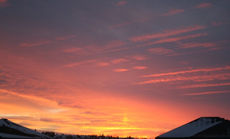 Sunset over Snowy Rooftops