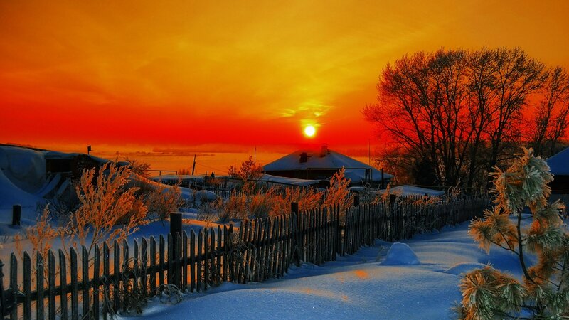 Sunset over Snowy Village — Orange, Dramatic