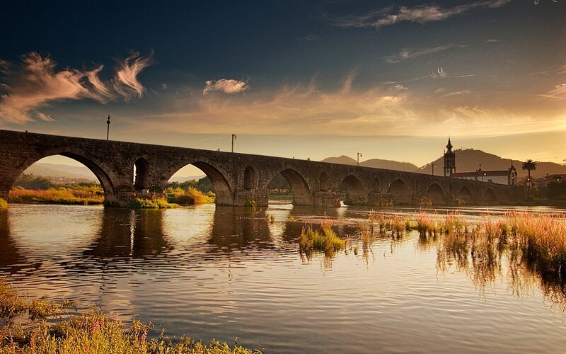Sunset over stone bridge