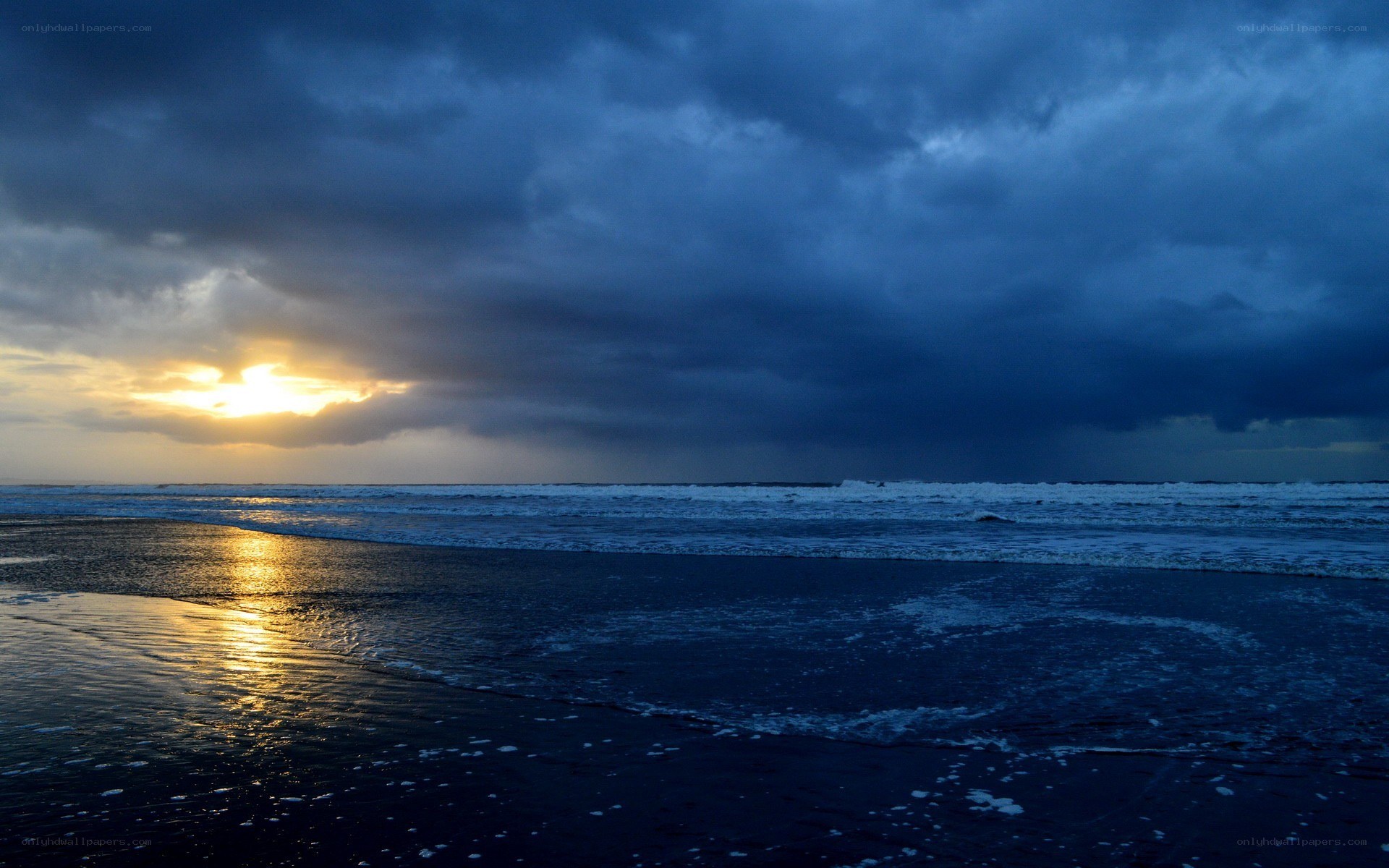 sunset over stormy ocean