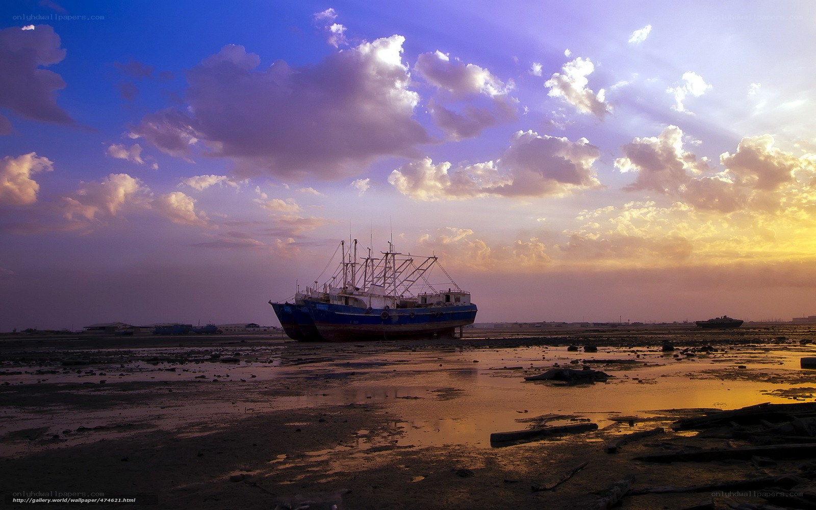 Sunset over stranded fishing boats