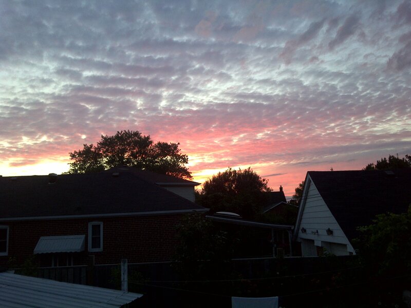 sunset over suburban homes