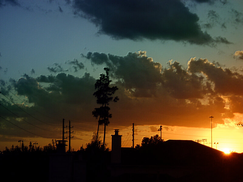 sunset over suburban landscape