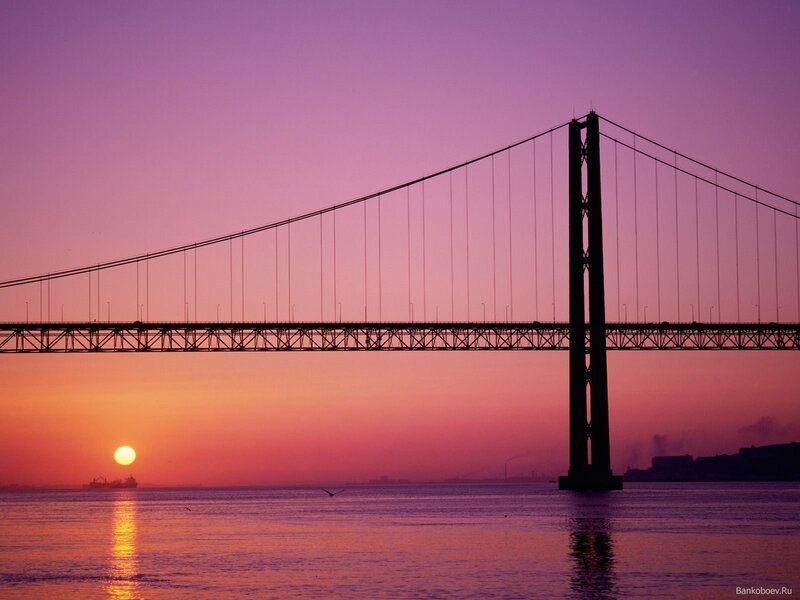 sunset over suspension bridge