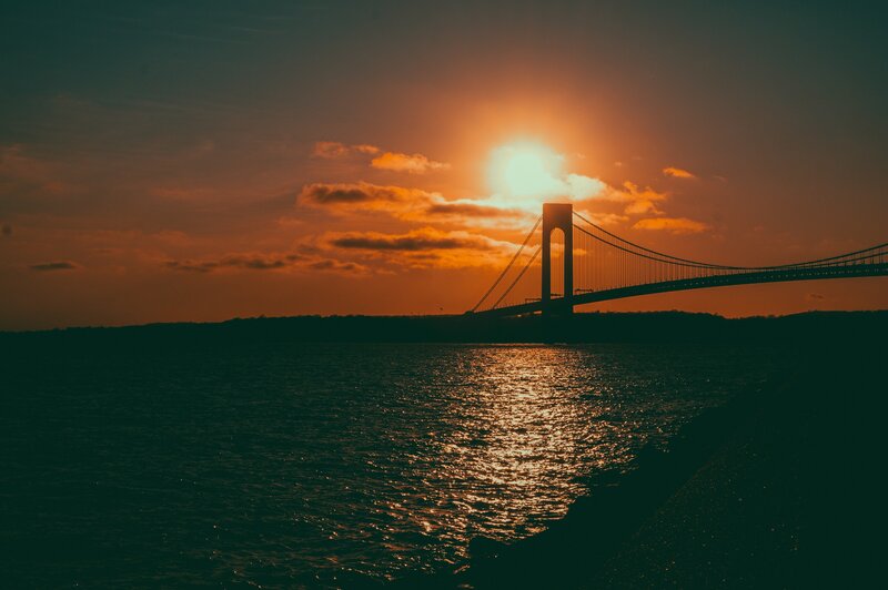 Sunset over Suspension Bridge — Orange, Dramatic, Photograph, Water
