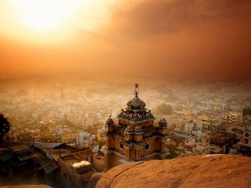 Sunset over temple and city