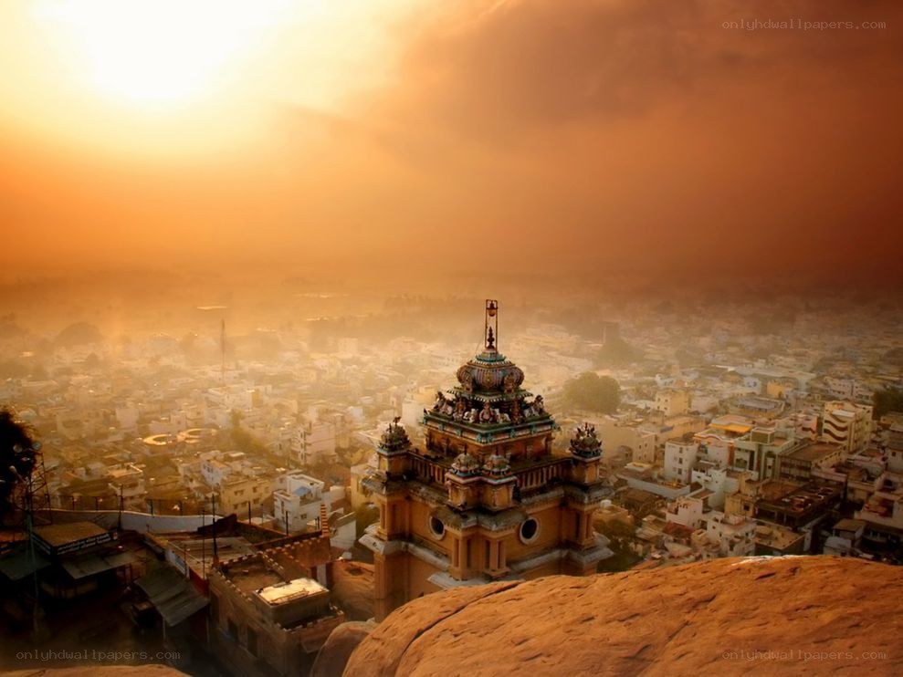 Sunset over temple and city