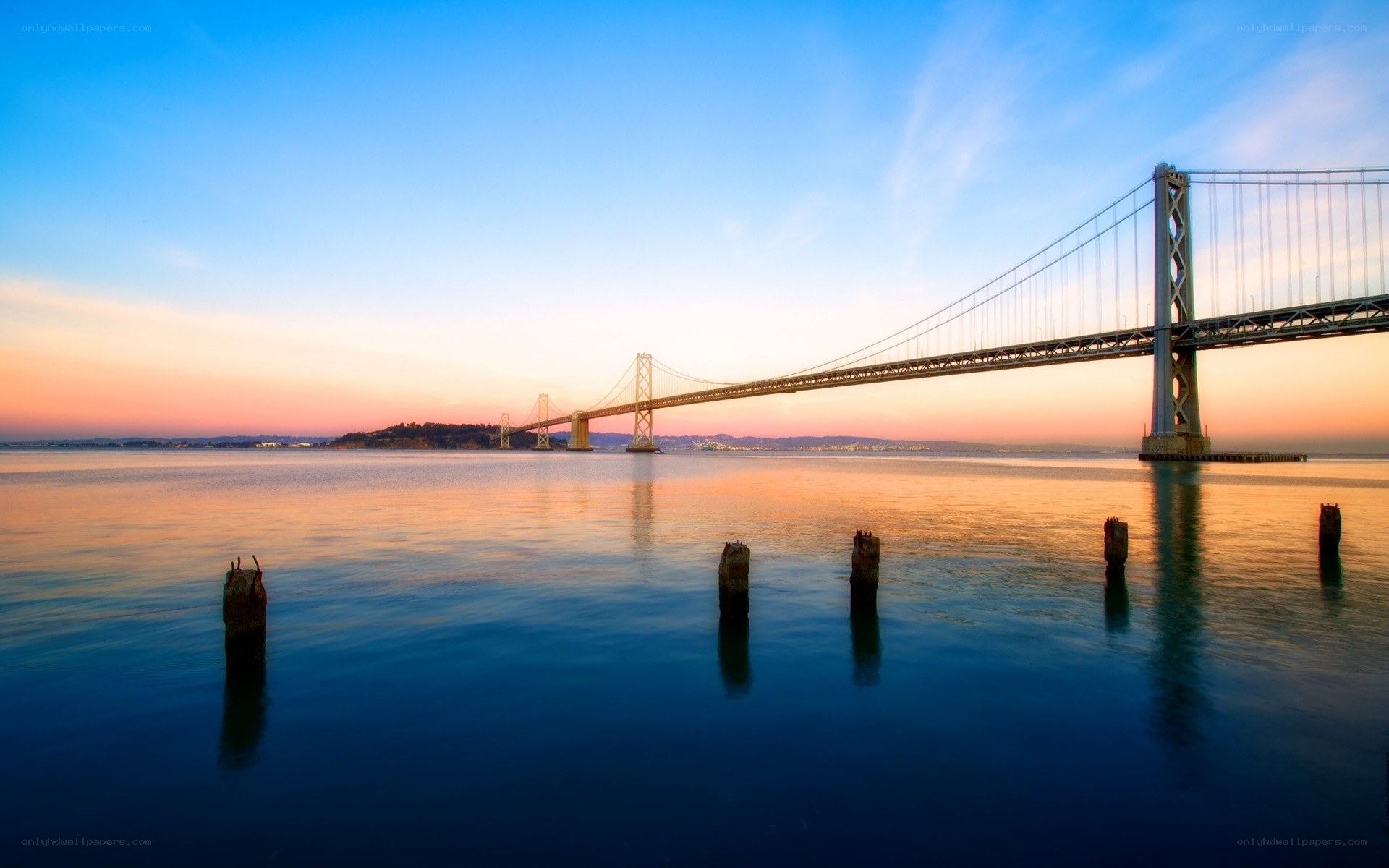 sunset over the bay bridge