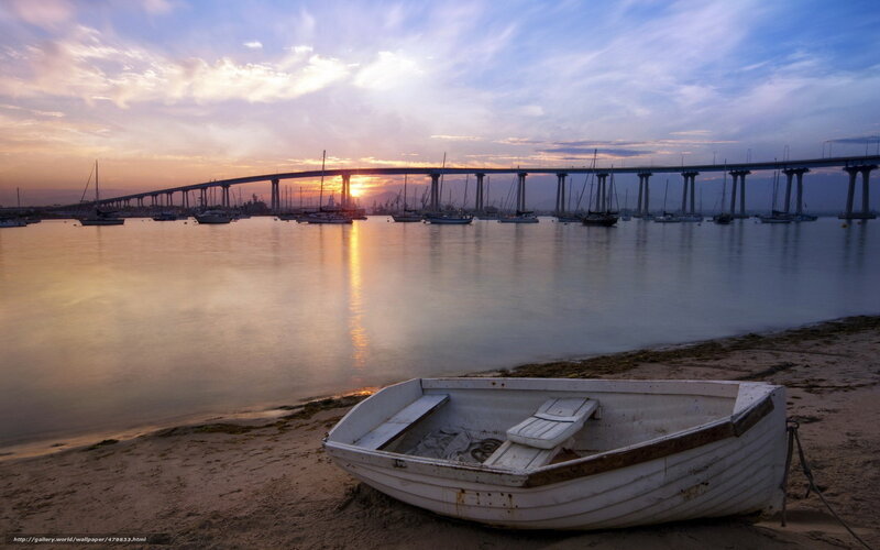 Sunset over the bridge and boats