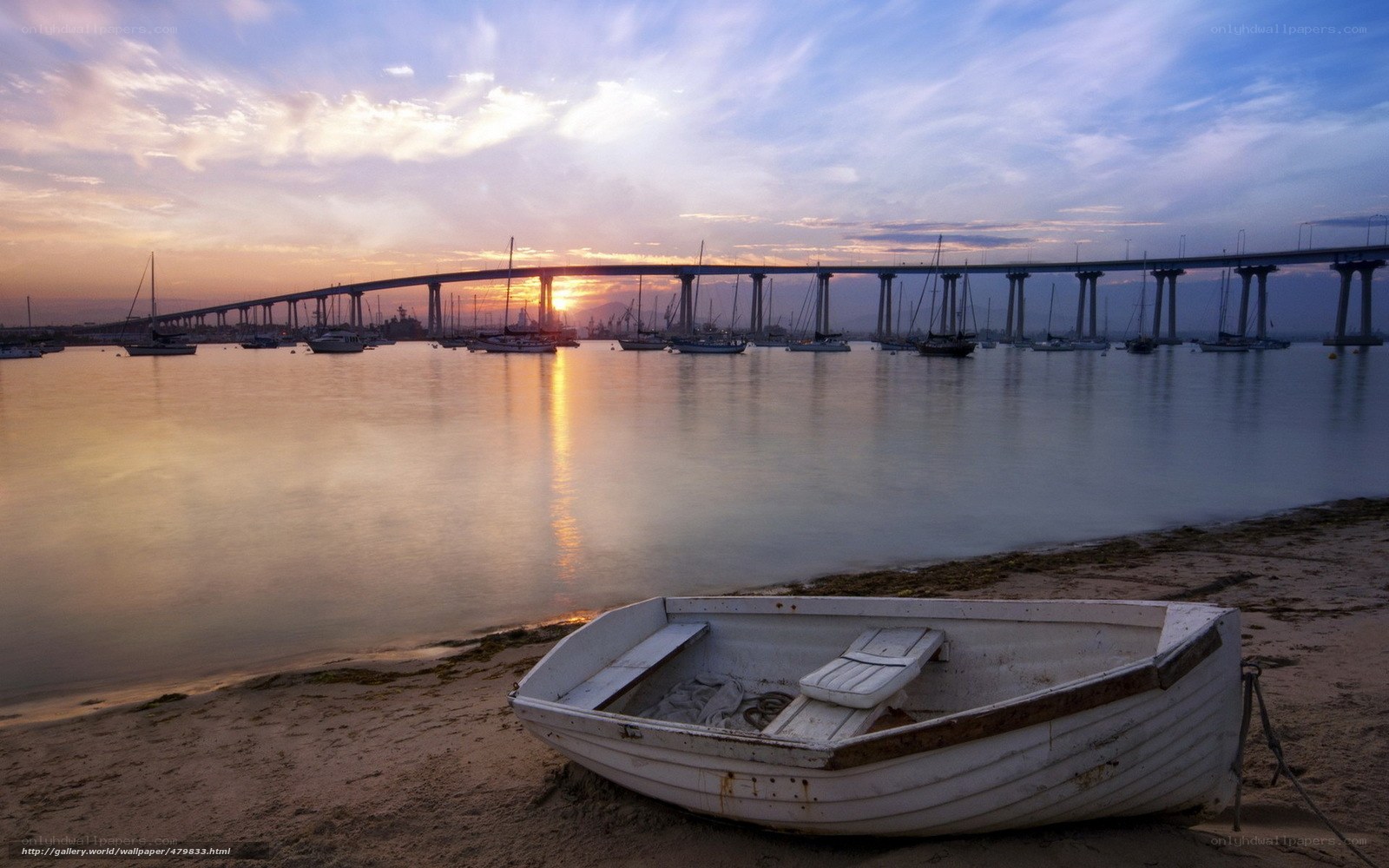 Sunset over the bridge and boats