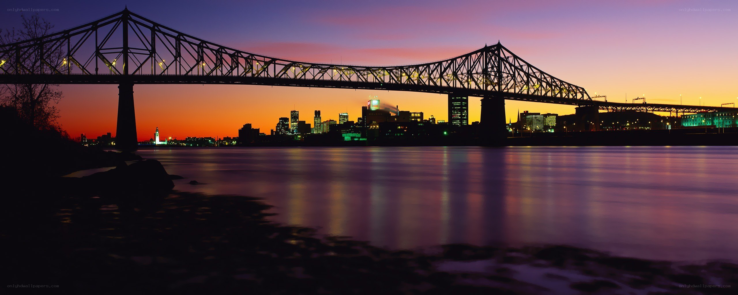sunset over the bridge and city