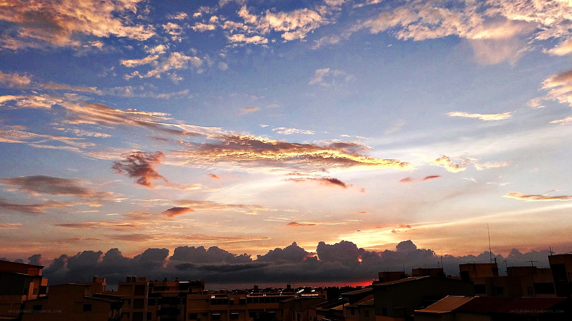 Sunset over the city rooftops