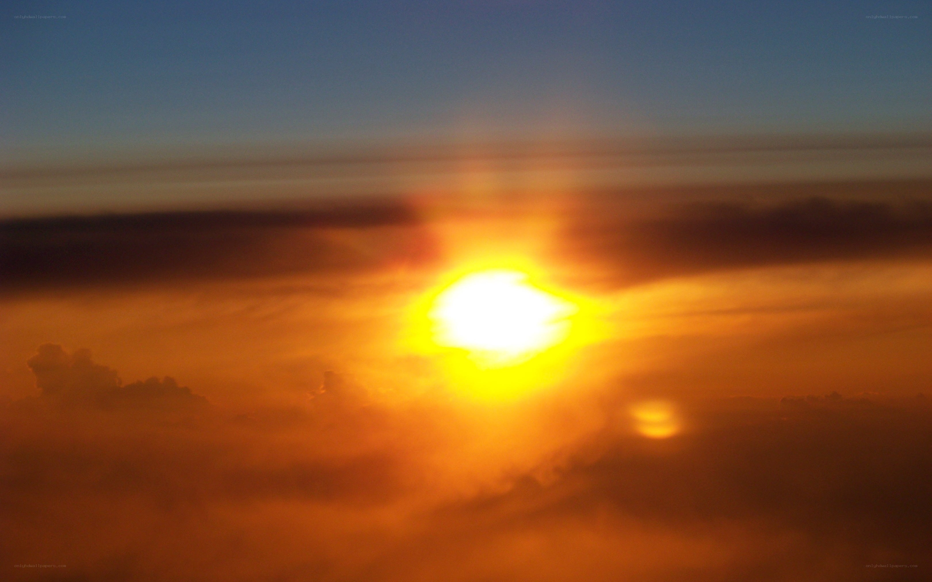 Sunset over the clouds
