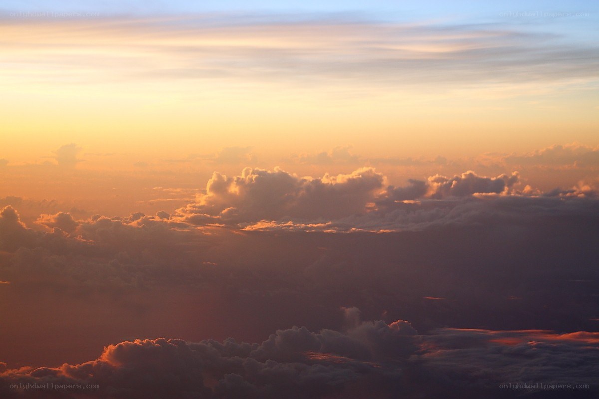 Sunset over the clouds