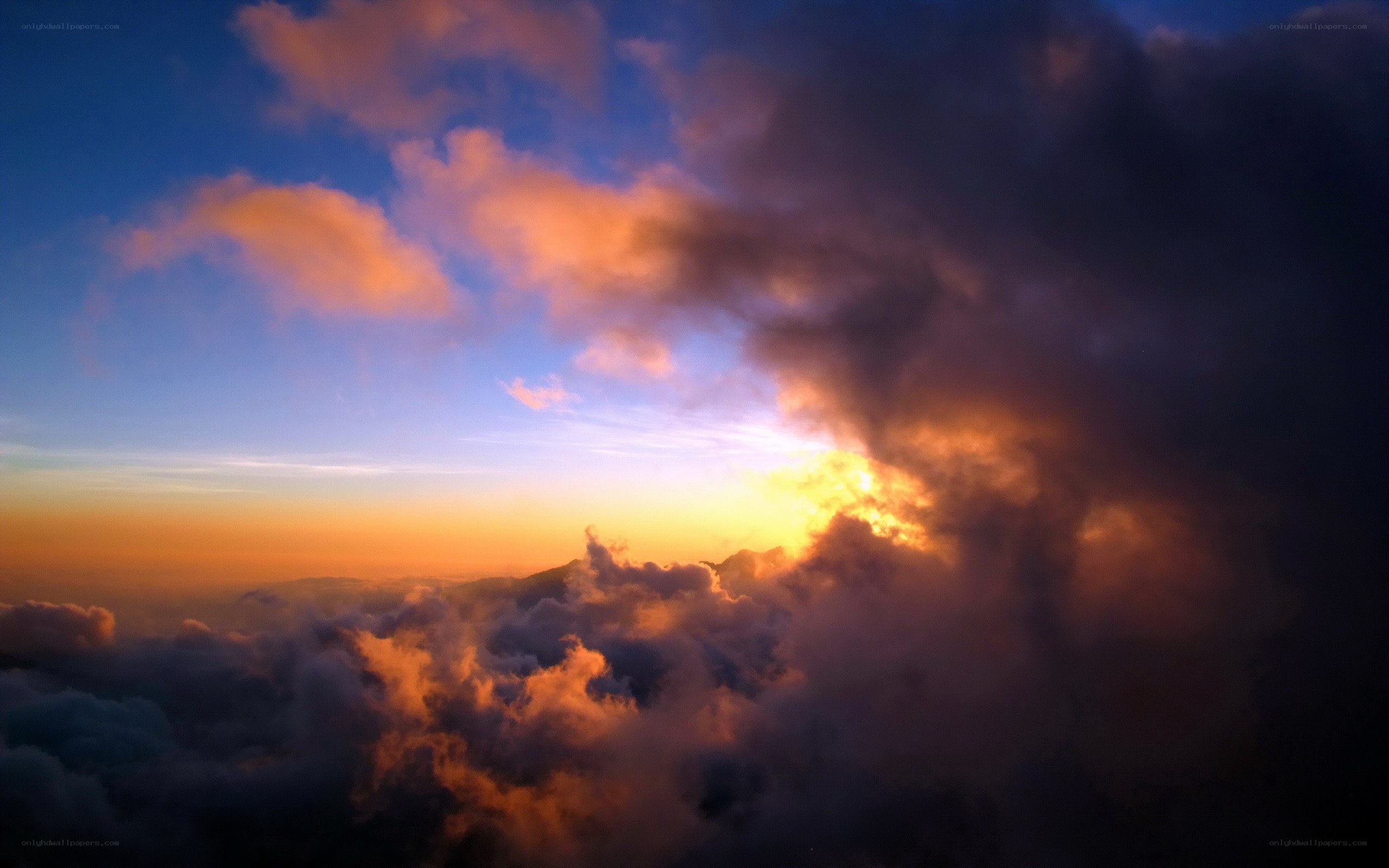 Sunset over the clouds