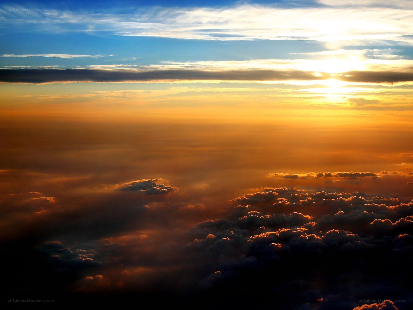 Sunset over the clouds