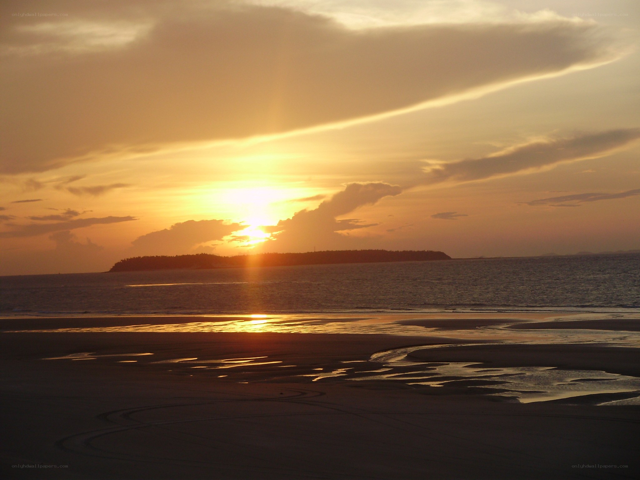 sunset over the island beach