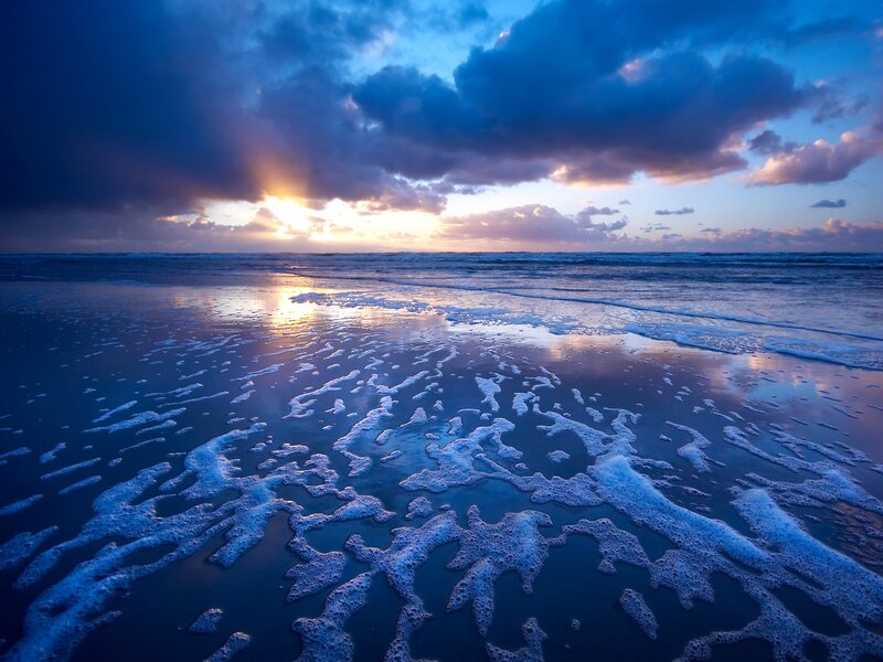 Sunset over the ocean beach