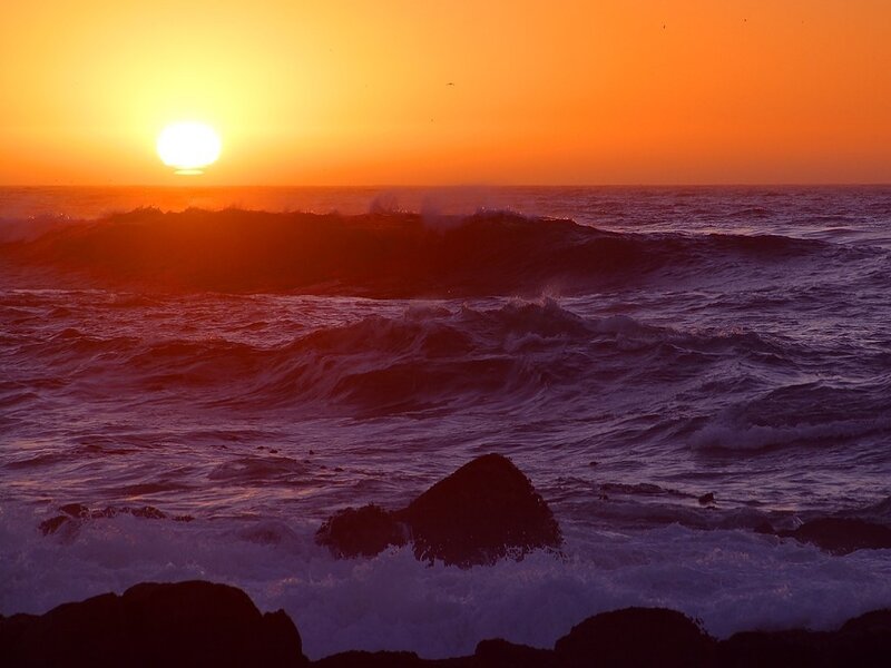 Sunset over the ocean waves