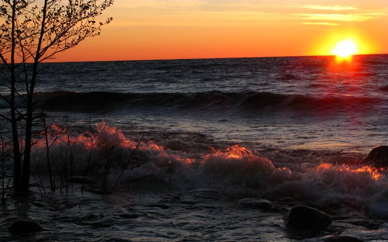 Sunset over the ocean waves