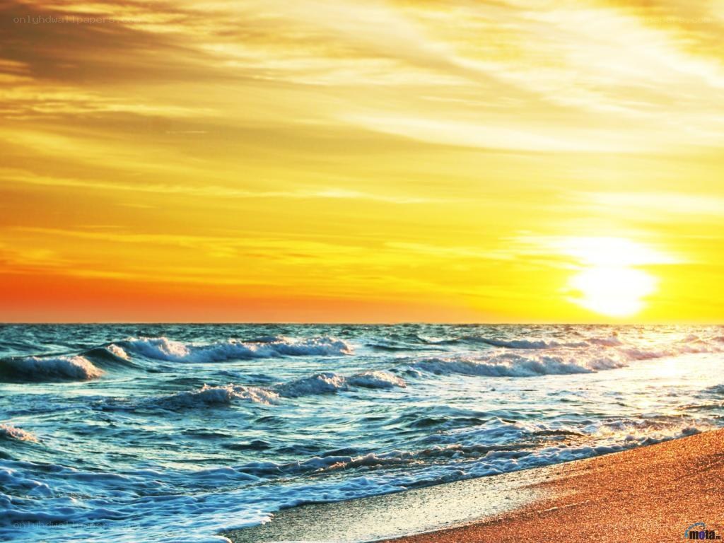 Sunset over the ocean waves
