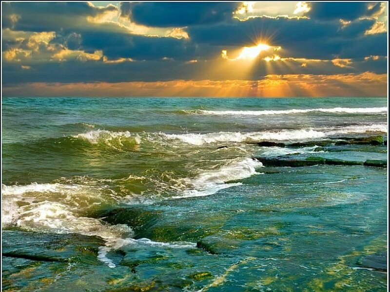 Sunset over the ocean waves