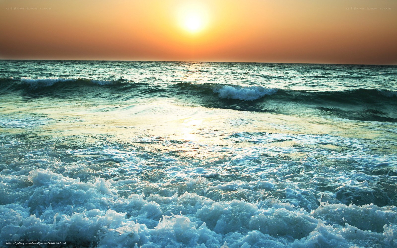 Sunset over the ocean waves