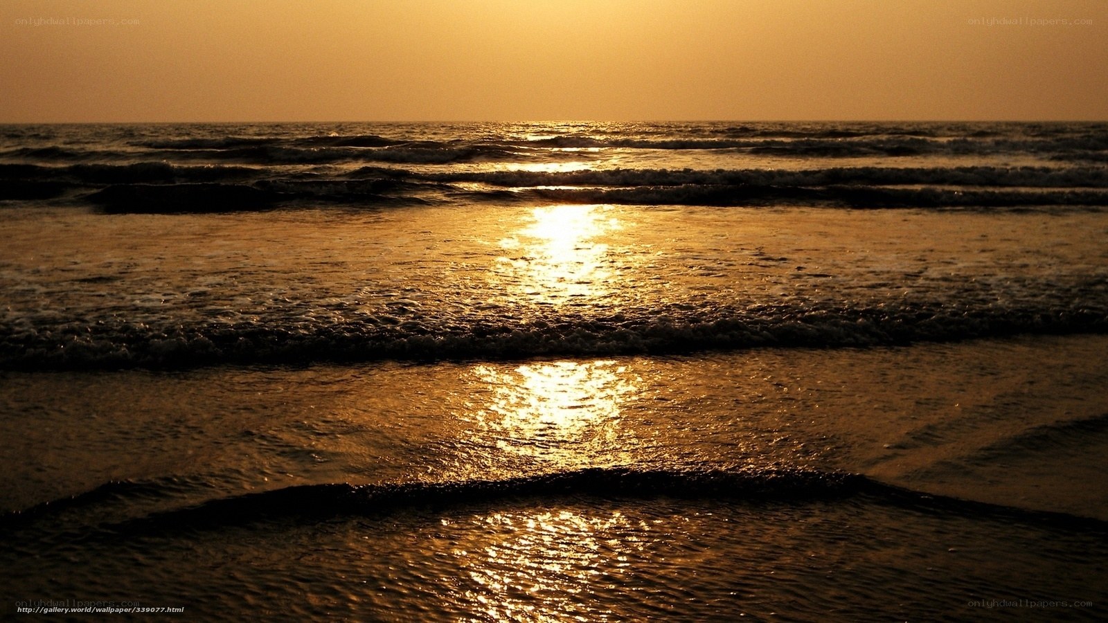 Sunset over the ocean waves