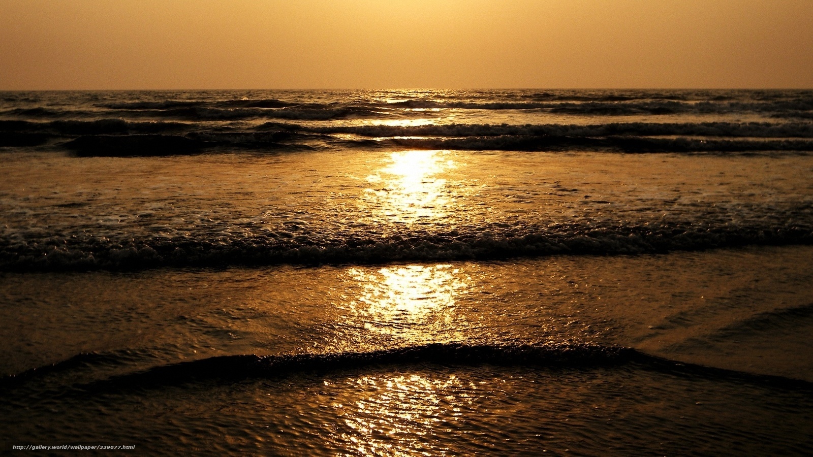Sunset over the ocean waves