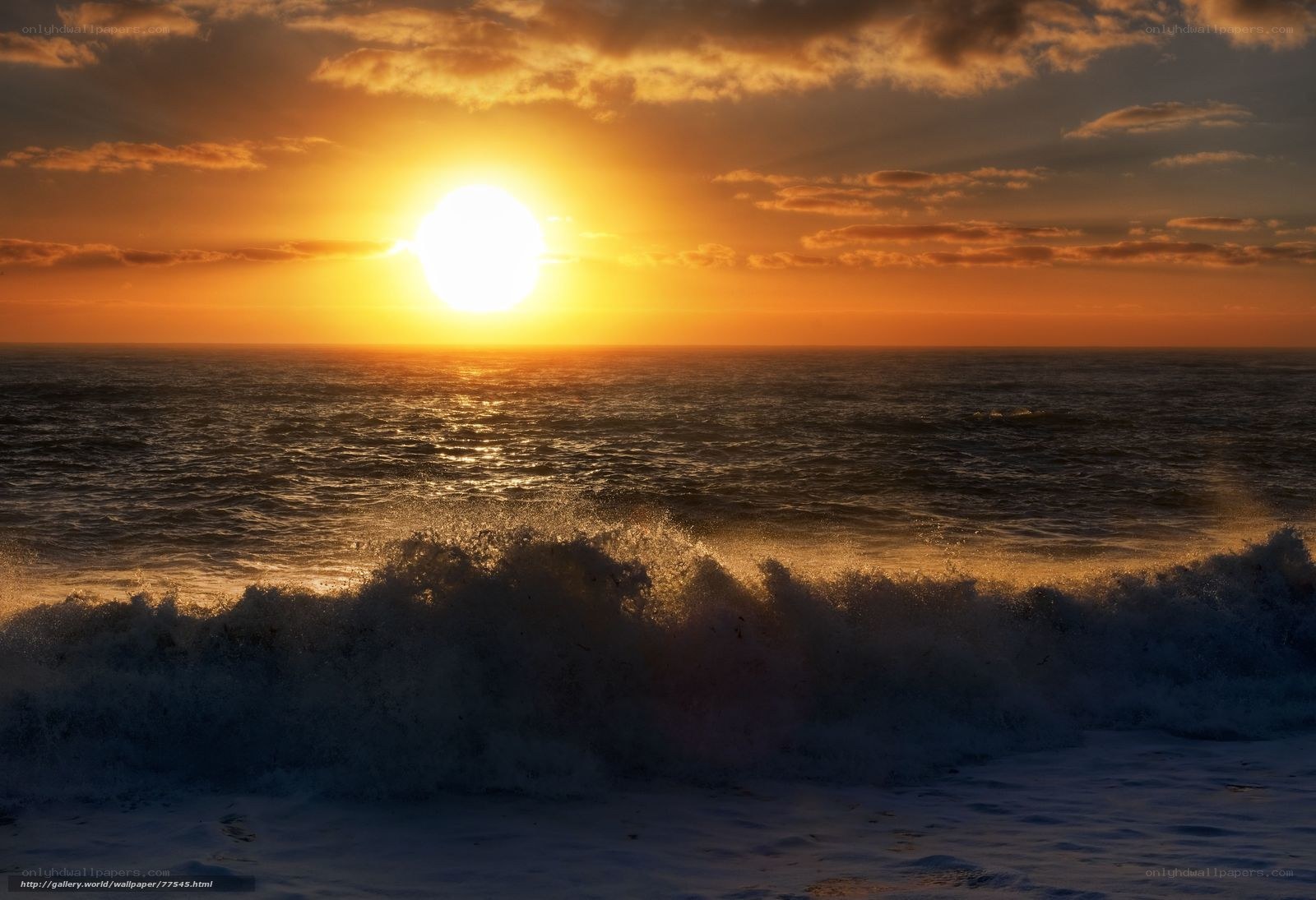 Sunset over the ocean waves