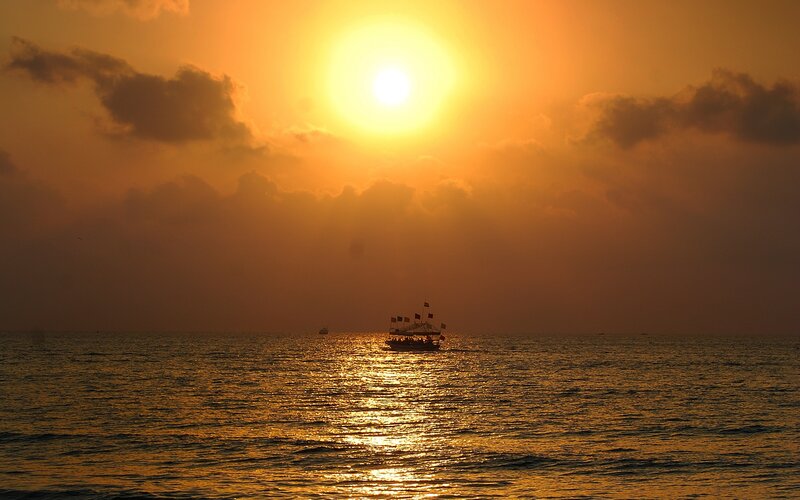 Sunset over the ocean with boat