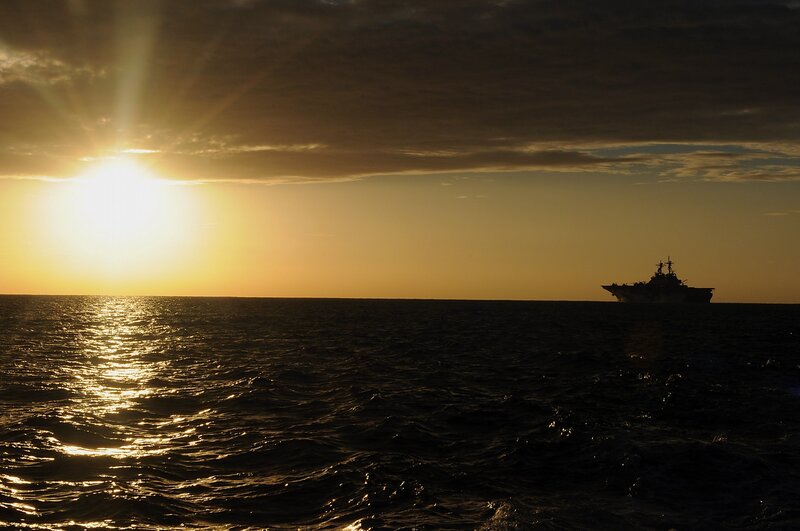 Sunset over the ocean with ship