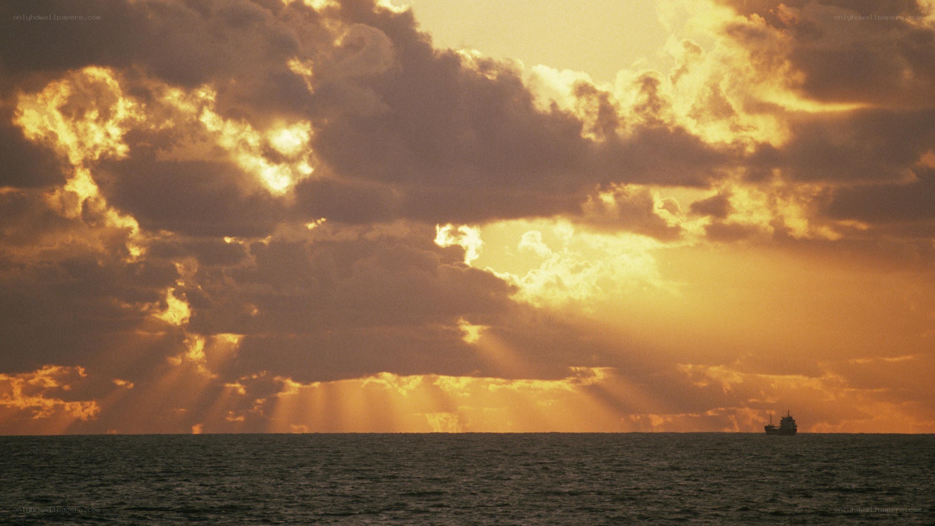 Sunset over the ocean with ship
