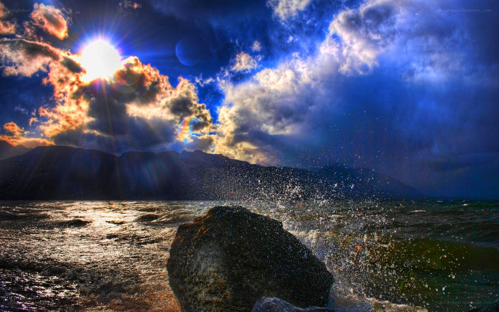 Sunset over the ocean with waves