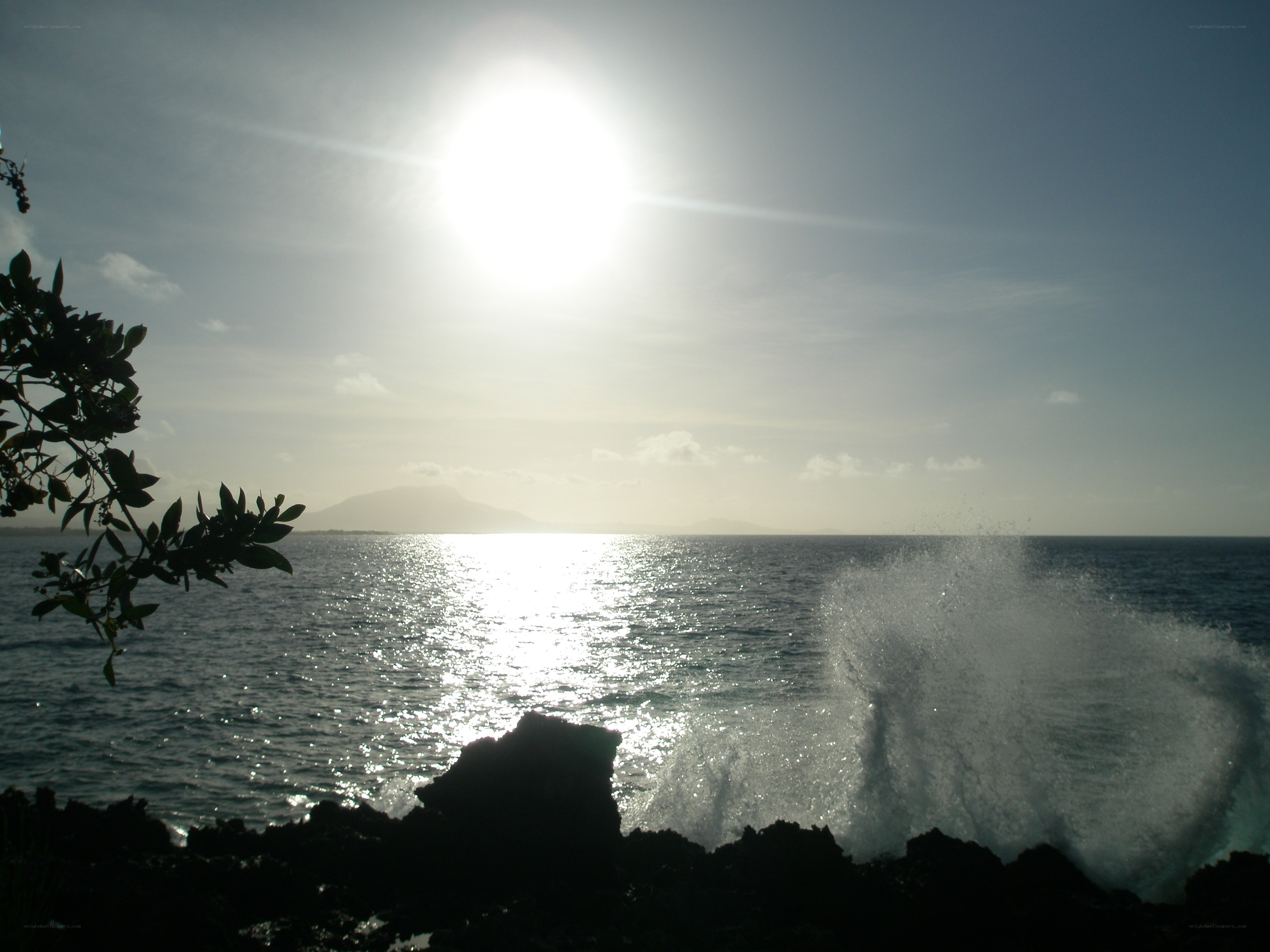 Sunset over the ocean with waves
